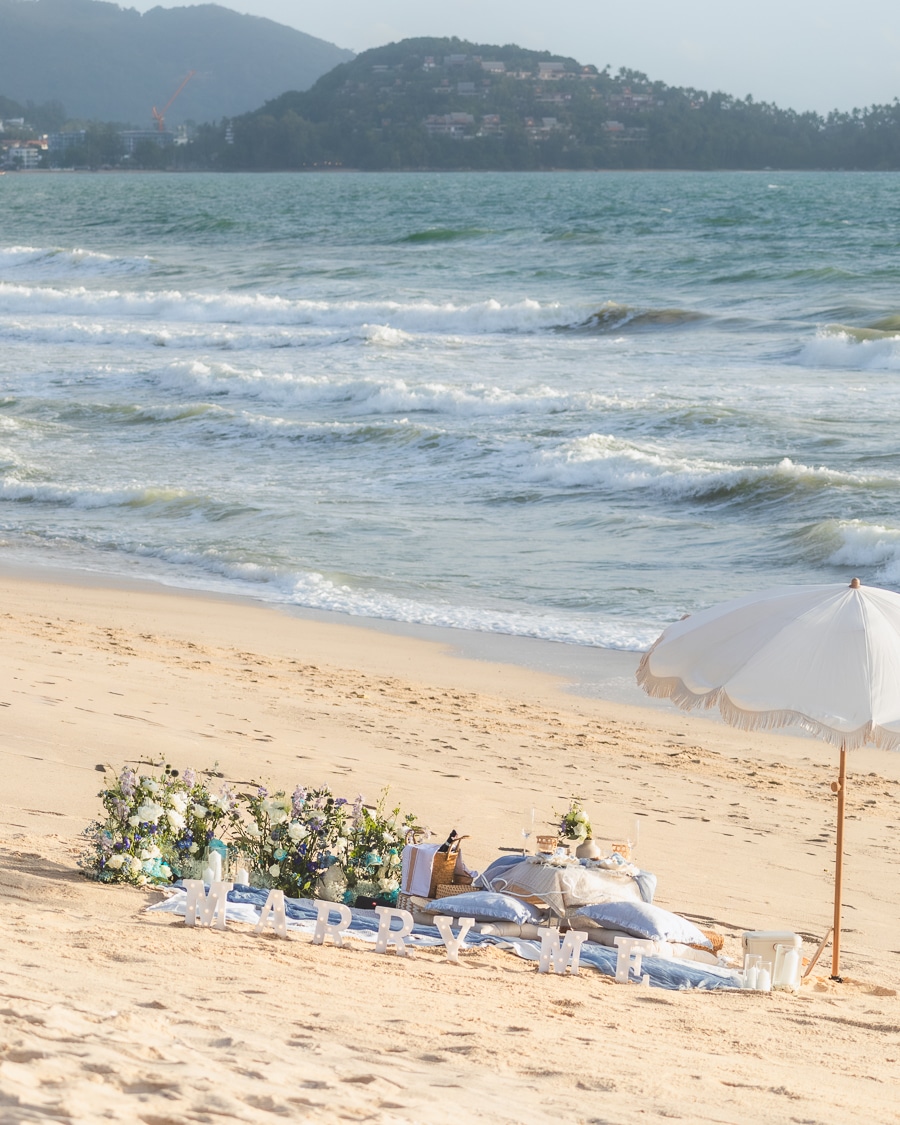 Phuket proposal setup with blossom flowers and picnic design